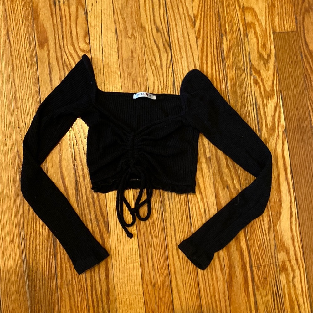 Black stretchy crop top with low and long sleeves